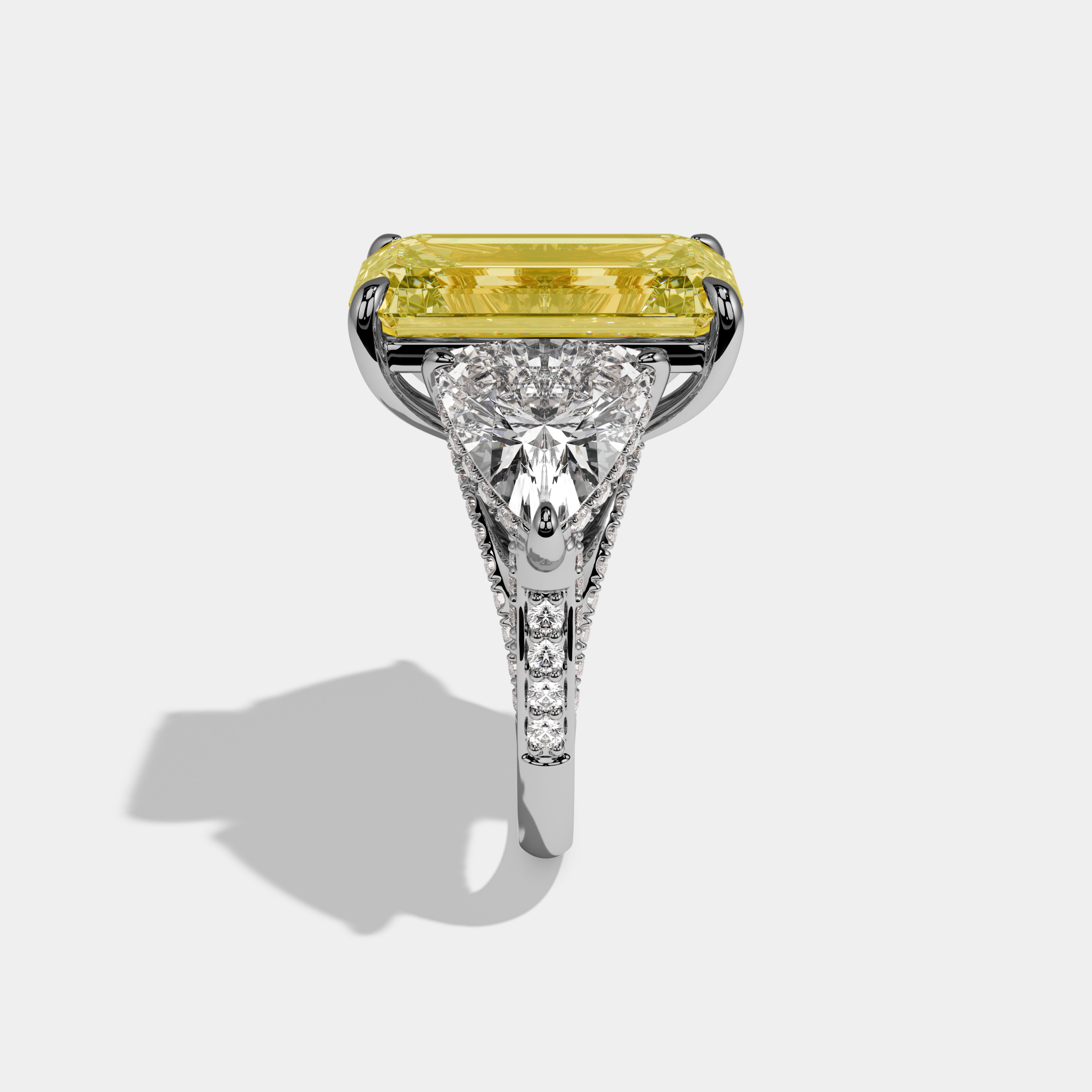 Charlotte Fancy Yellow Emerald Cut Diamond Halo With Twin Trillion Cut Sides Engagement Ring 10ct 18k White Gold