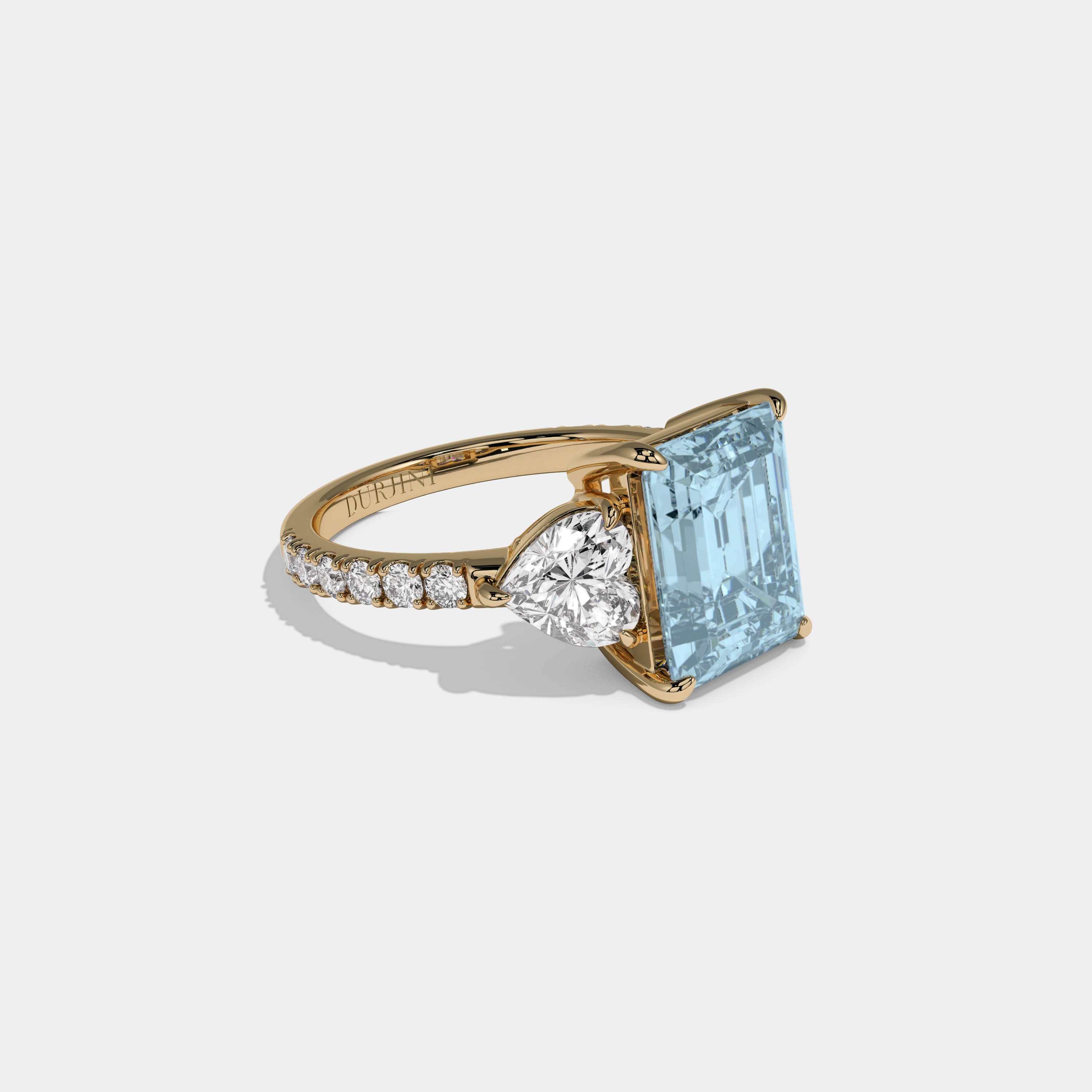 Caroline Fancy Light Blue Emerald Cut Diamond Band With Heart Cut Sides Engagement Ring 8ct 18K Yellow Gold