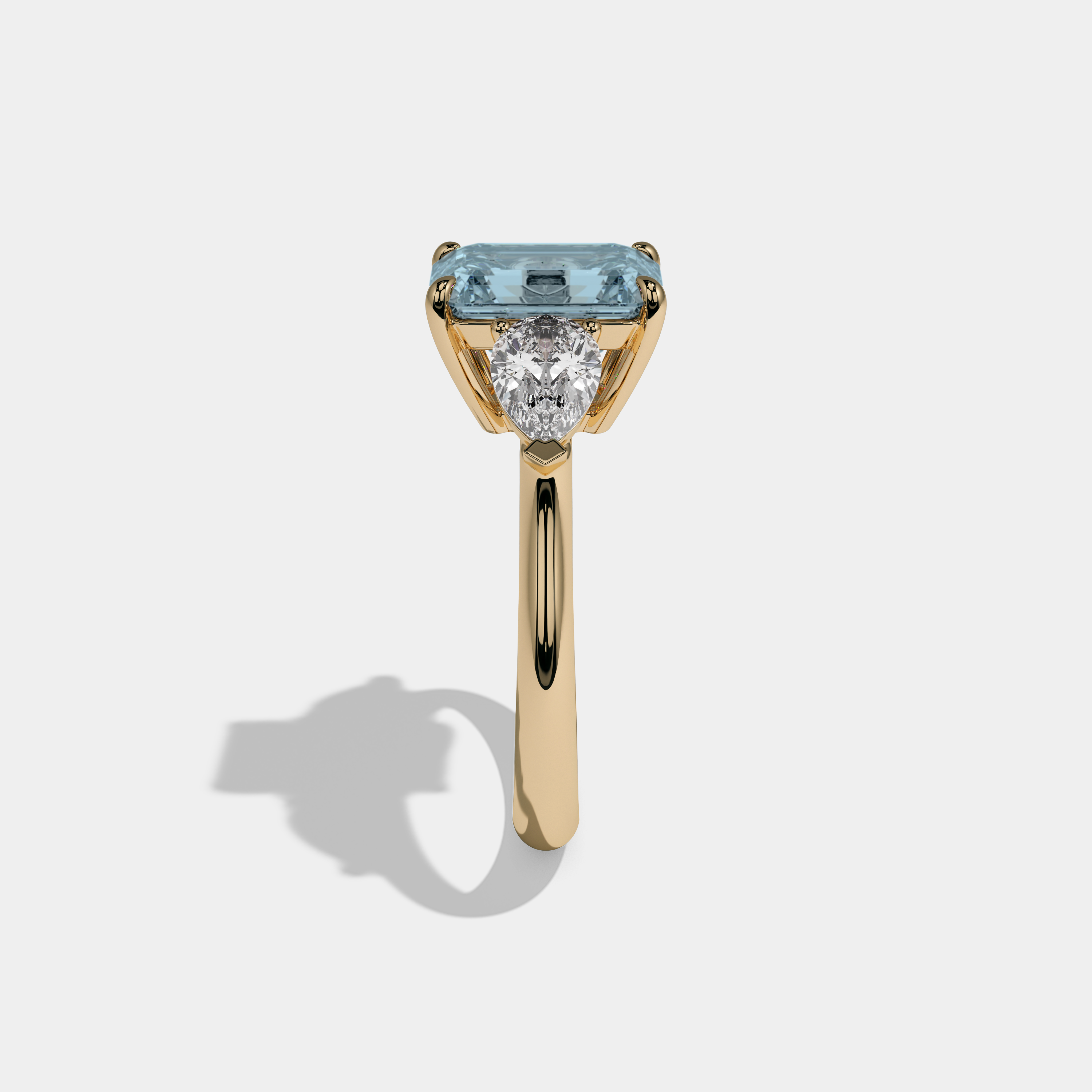 Millicent Fancy Light Blue Emerald Cut Diamond Plain Band With Pear Cut Sides Engagement Ring 6ct 18K Yellow Gold