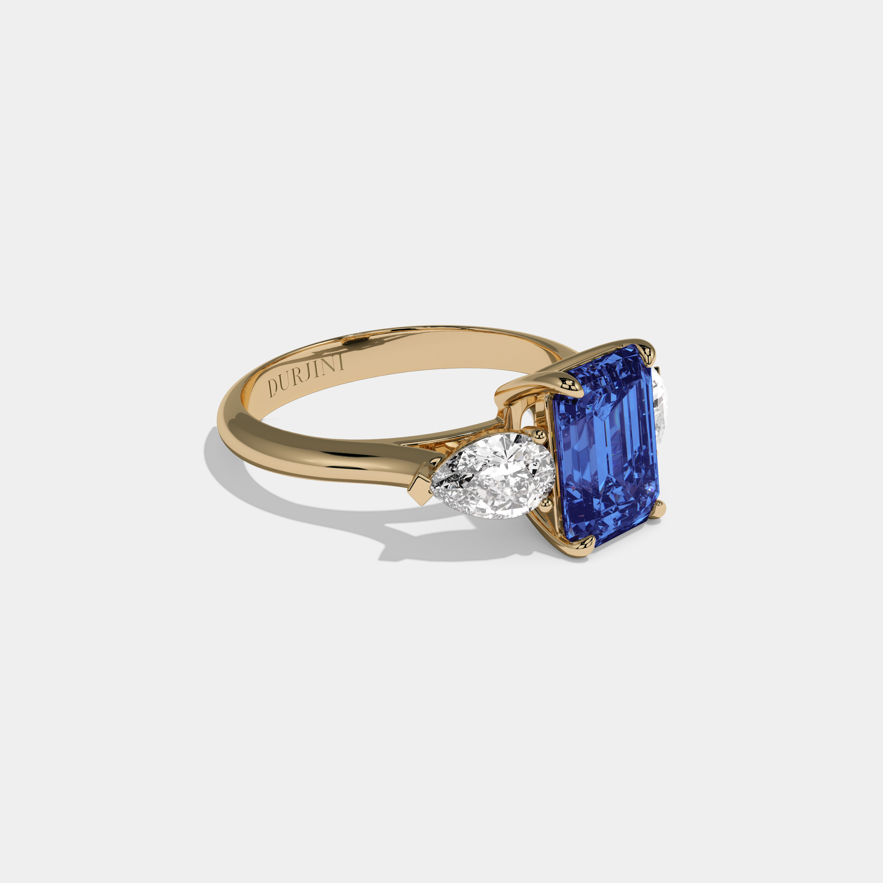 Alexandrina Fancy Dark Blue Emerald Cut Diamond Plain Band With Pear Cut Sides Engagement Ring 6ct 18K Yellow Gold