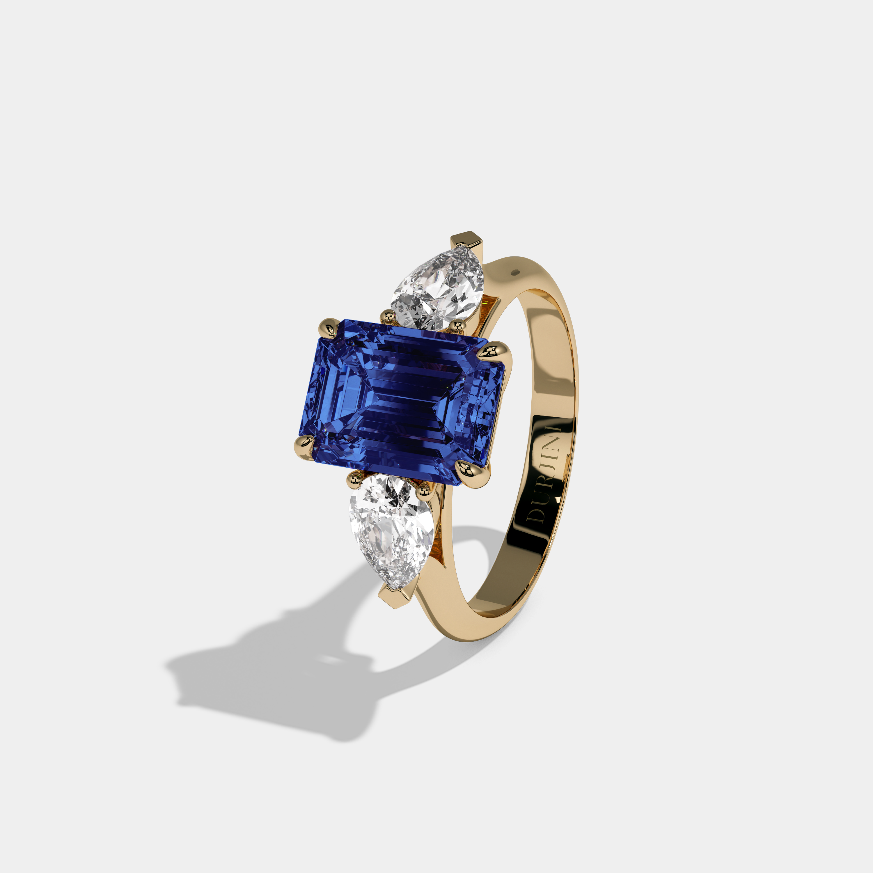 Alexandrina Fancy Dark Blue Emerald Cut Diamond Plain Band With Pear Cut Sides Engagement Ring 6ct 18K Yellow Gold