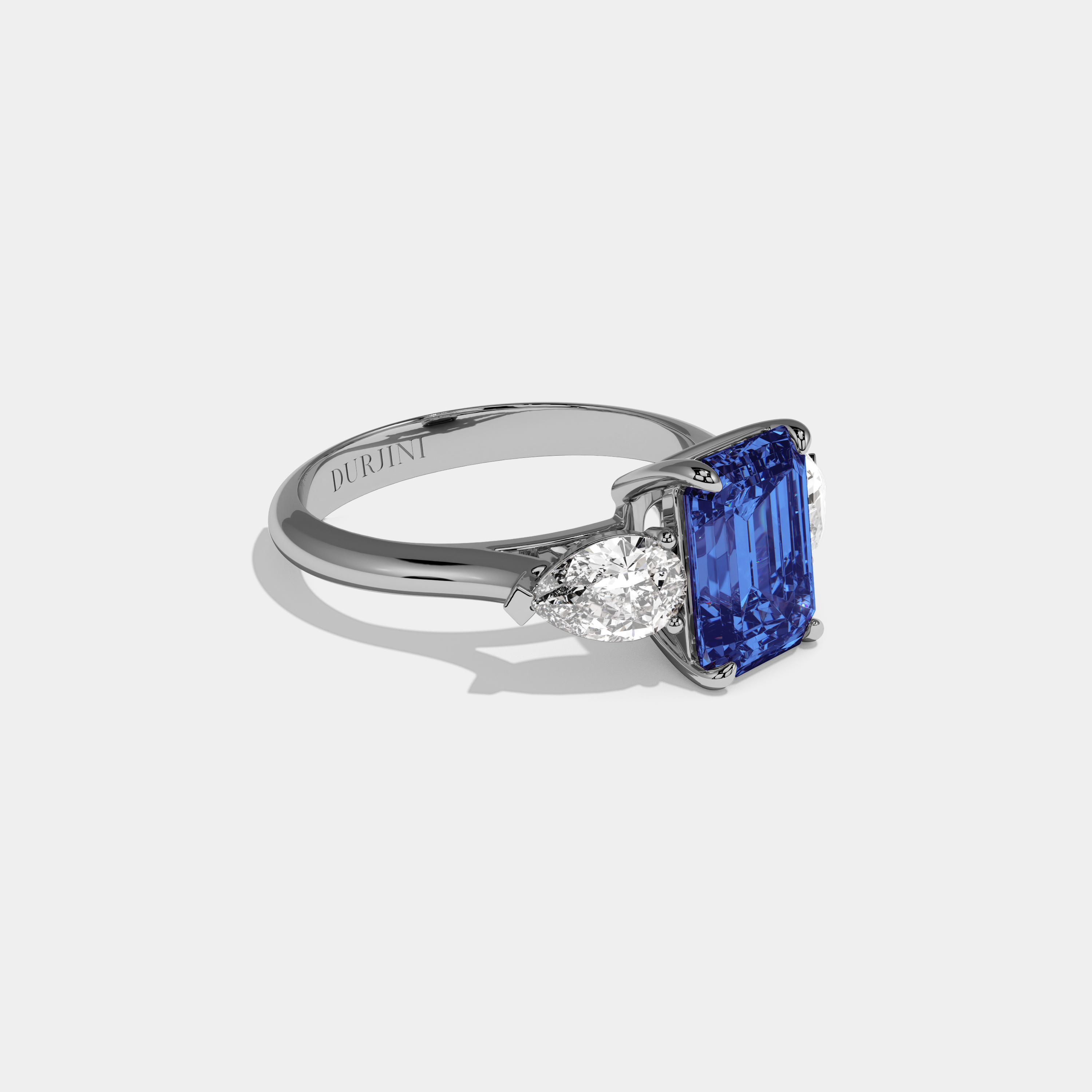 Sophronia Fancy Dark Blue Emerald Cut Diamond Plain Band With Pear Cut Sides Engagement Ring 6ct 18K White Gold