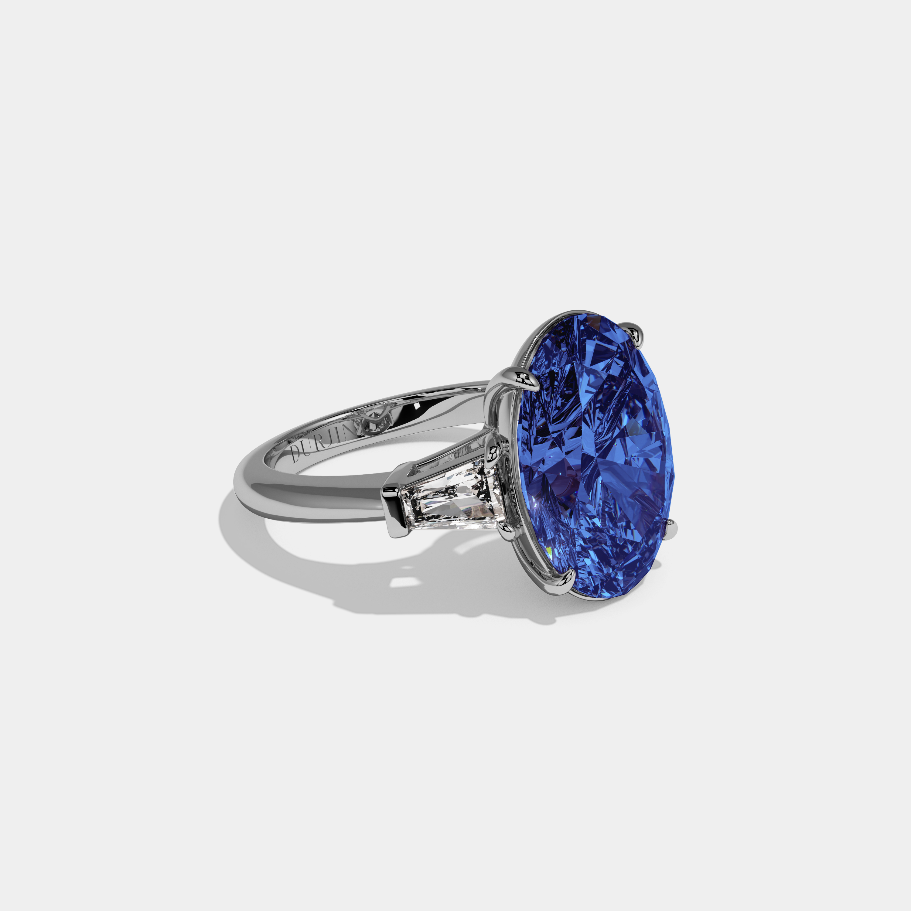 Elizabeth Fancy Dark Blue Oval Cut Diamond Plain Band With Tapered Baguette Cut Sides Engagement Ring 8ct 18K White Gold