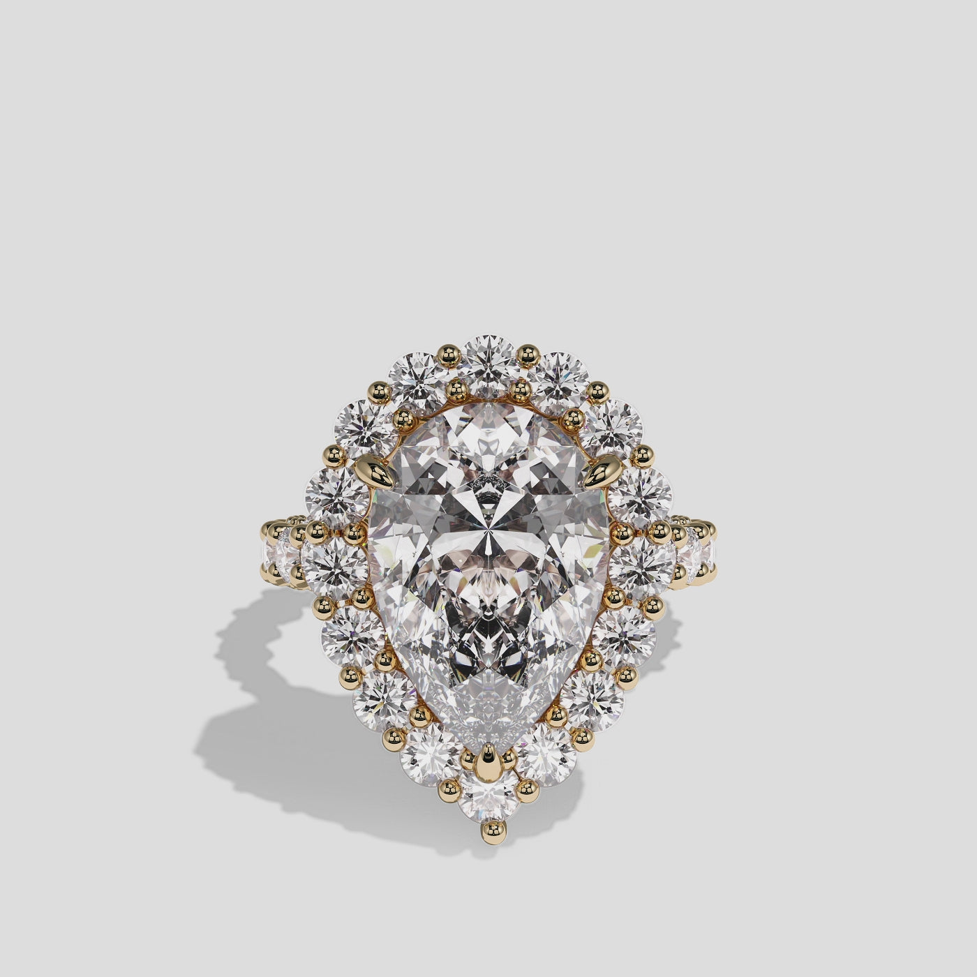 Judith Fairbourne diamond pear halo engagement ring in 18K yellow gold by Kurbãni Durjini, 360-degree view